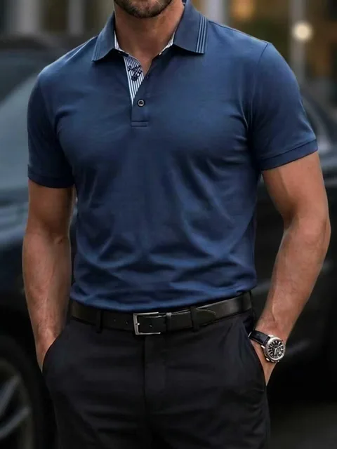 Man wearing a navy performance polo shirt