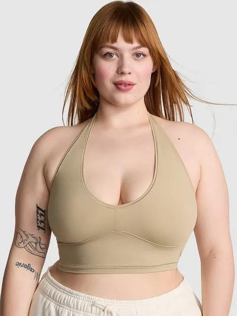 Woman wearing a stretch halter top for swimwear applications